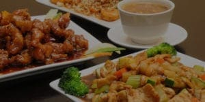 Variety of Chinese dishes on a table.